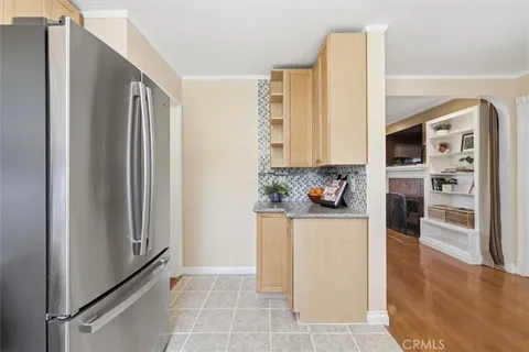 a kitchen with stainless steel appliances a refrigerator and a stove