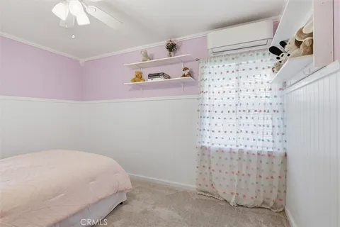 a bedroom with a bed and a shower curtain