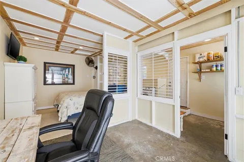 a view of a livingroom with furniture and a window