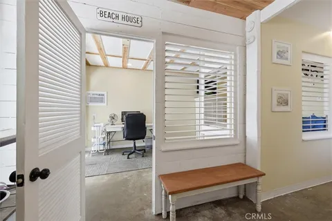 a bedroom with furniture and a window