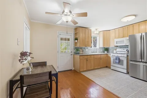 a kitchen with a refrigerator and a sink