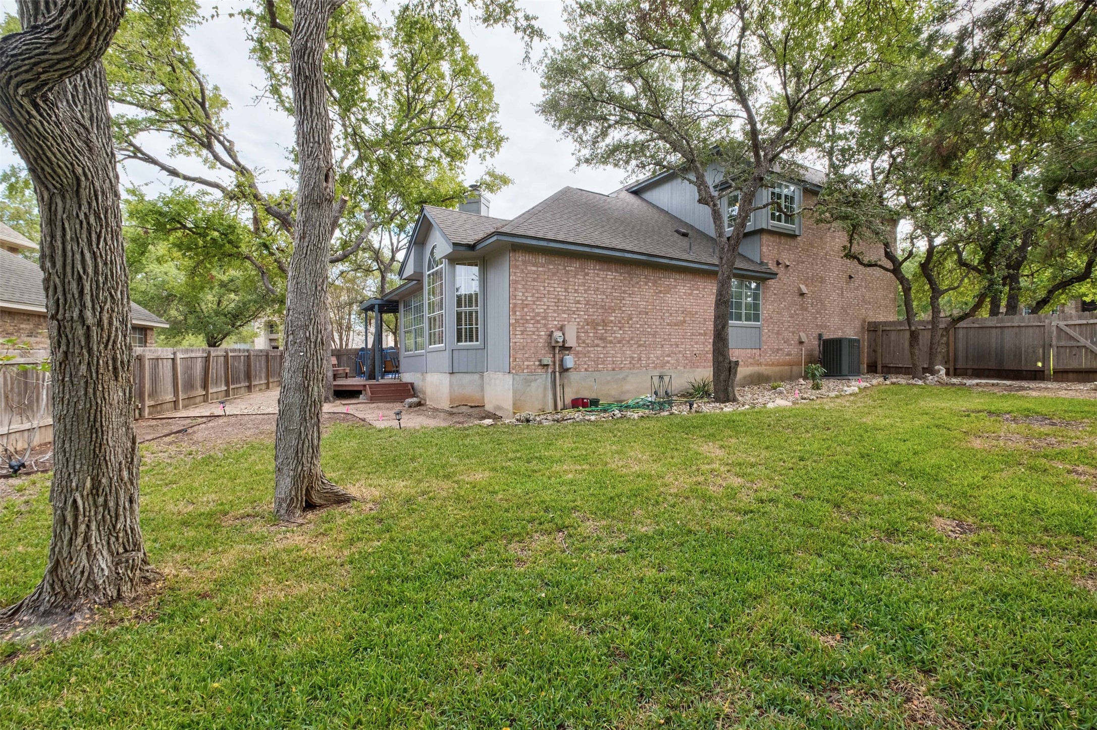 3704 Runnels Court Austin, TX 78732 - Photo 23 of 30 View of home's exterior, fenced backyard