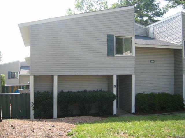 4800 Walden Court, Unit E Raleigh, NC 27604 - Photo 1 of 1 a front view of a house with a yard