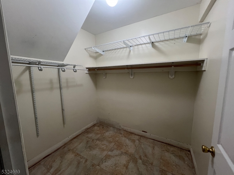 692 East 26th Street, Unit 1 Paterson, NJ 07504 - Photo 5 of 6 a view of a room with racks on the wall