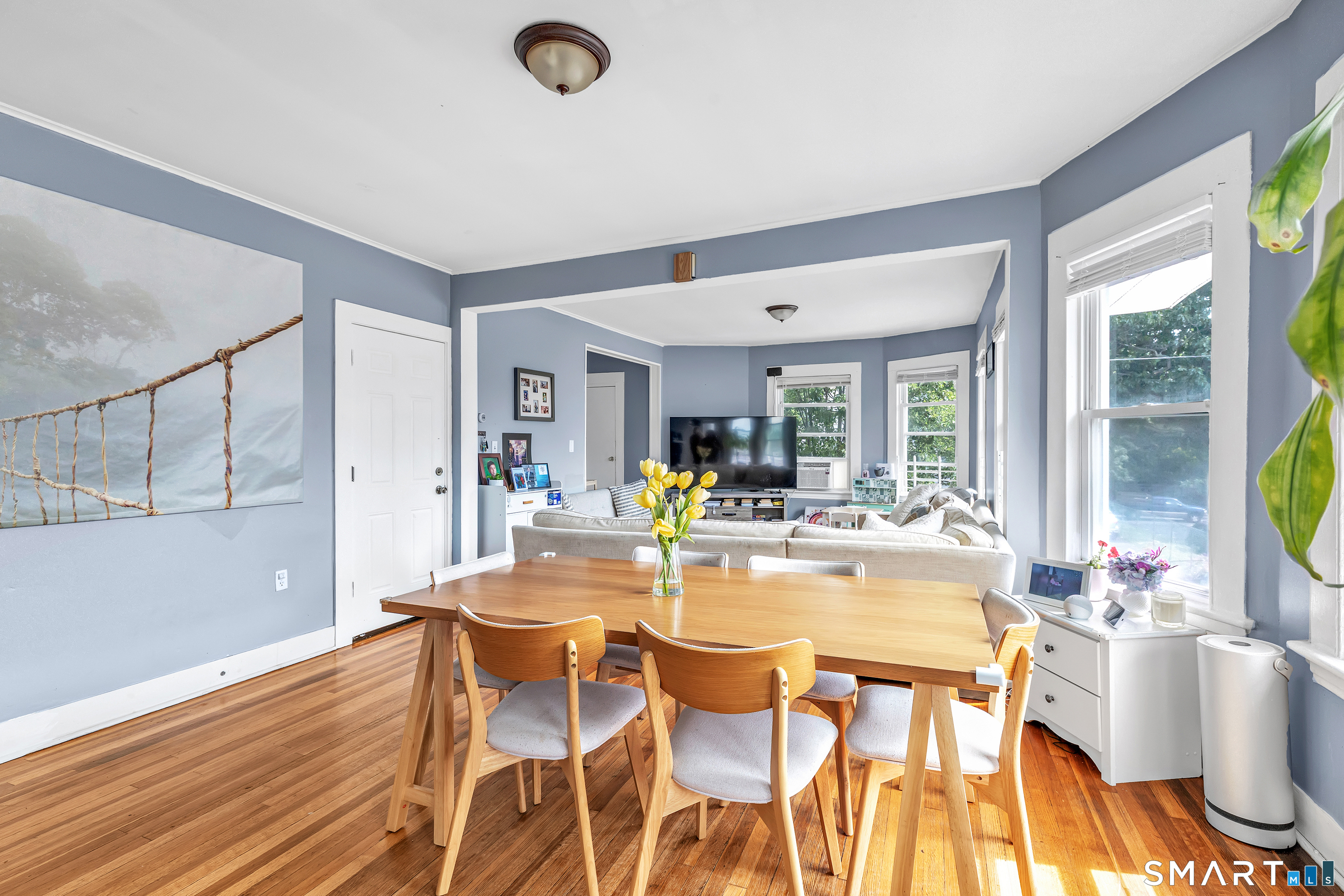 189 Wells Street Bridgeport, CT 06606 - Photo 9 of 40 2nd Floor - Offers 1389 sq ft -Shared LR & DR has operable wood burning fireplace, hardwood floors