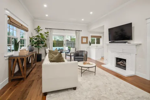a living room with furniture fireplace and a flat screen tv