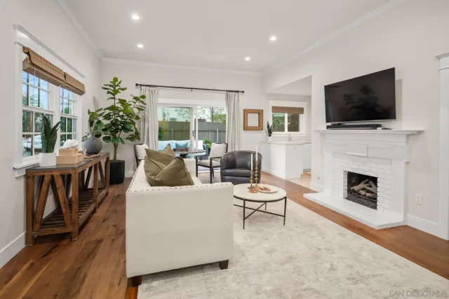 a living room with furniture fireplace and a flat screen tv