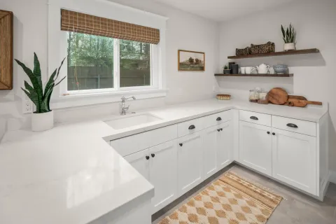 a kitchen with a refrigerator and sink