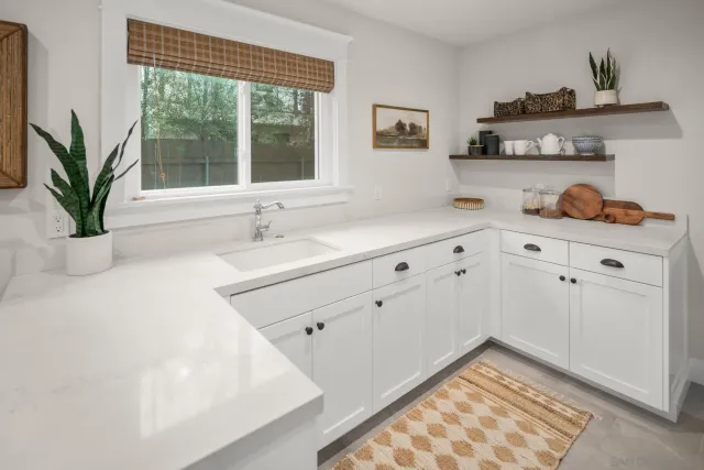 a kitchen with a refrigerator and sink