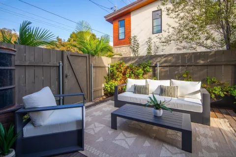 a view of patio with a table and chairs