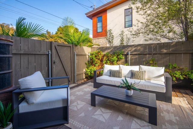 a view of patio with a table and chairs
