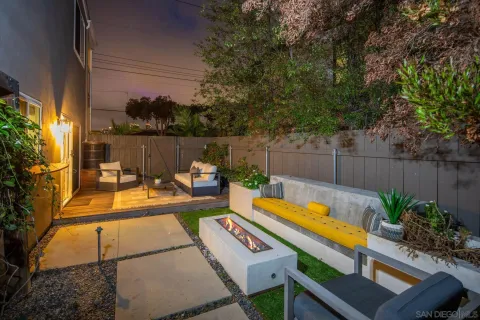 a view of a backyard with sitting area