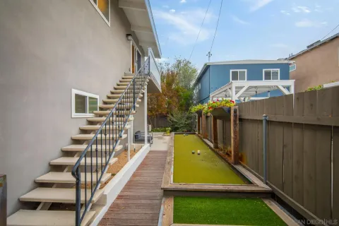 a view of a backyard with swimming pool