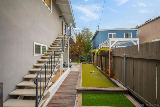 a view of a backyard with swimming pool