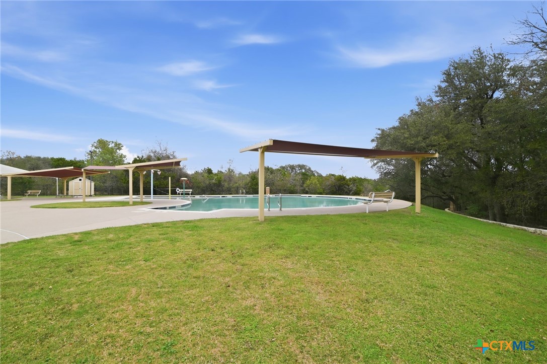 316 Housefinch Loop Leander, TX 78641 - Photo 34 of 37 Community pool and splash area in Summerlyn.