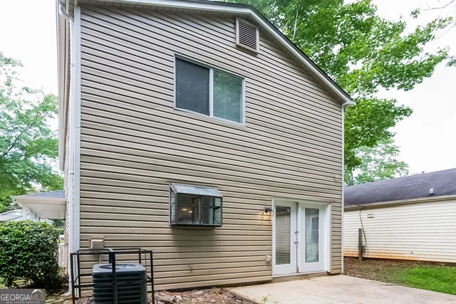 a view of a house with a yard and garage