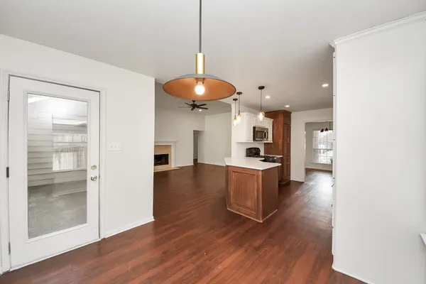 a kitchen with a refrigerator and a stove