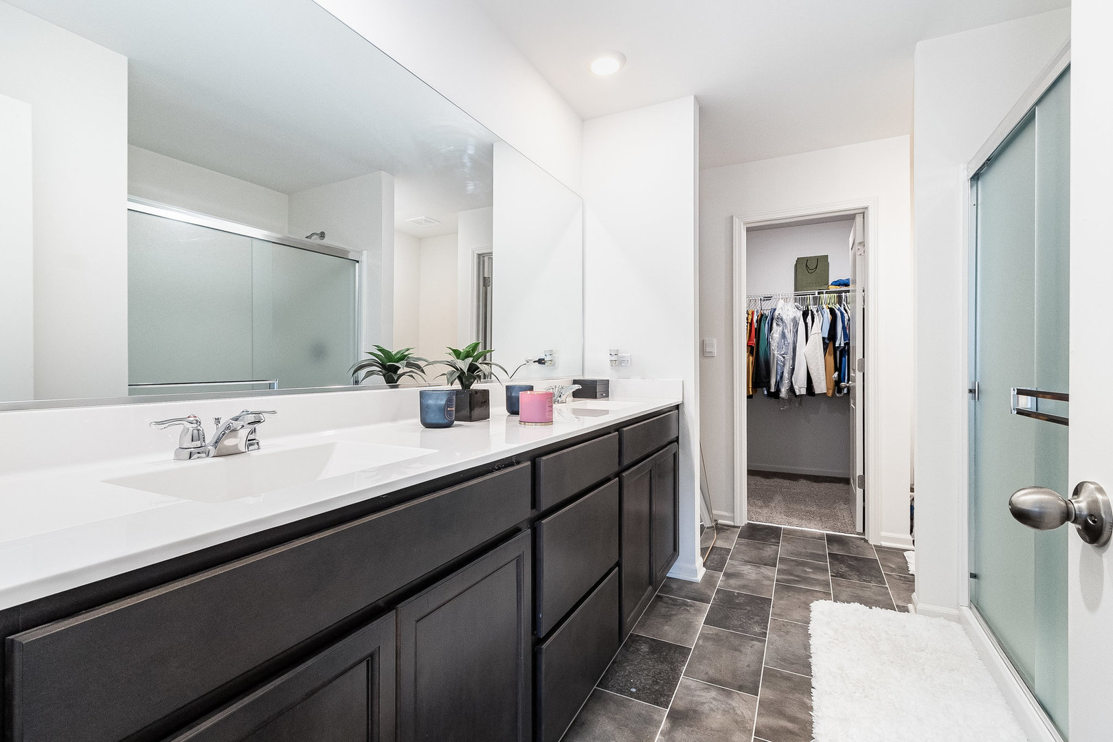 382 Hemlock Lane Oswego, IL 60543 - Photo 14 of 17 a bathroom with a double vanity sink a and a mirror