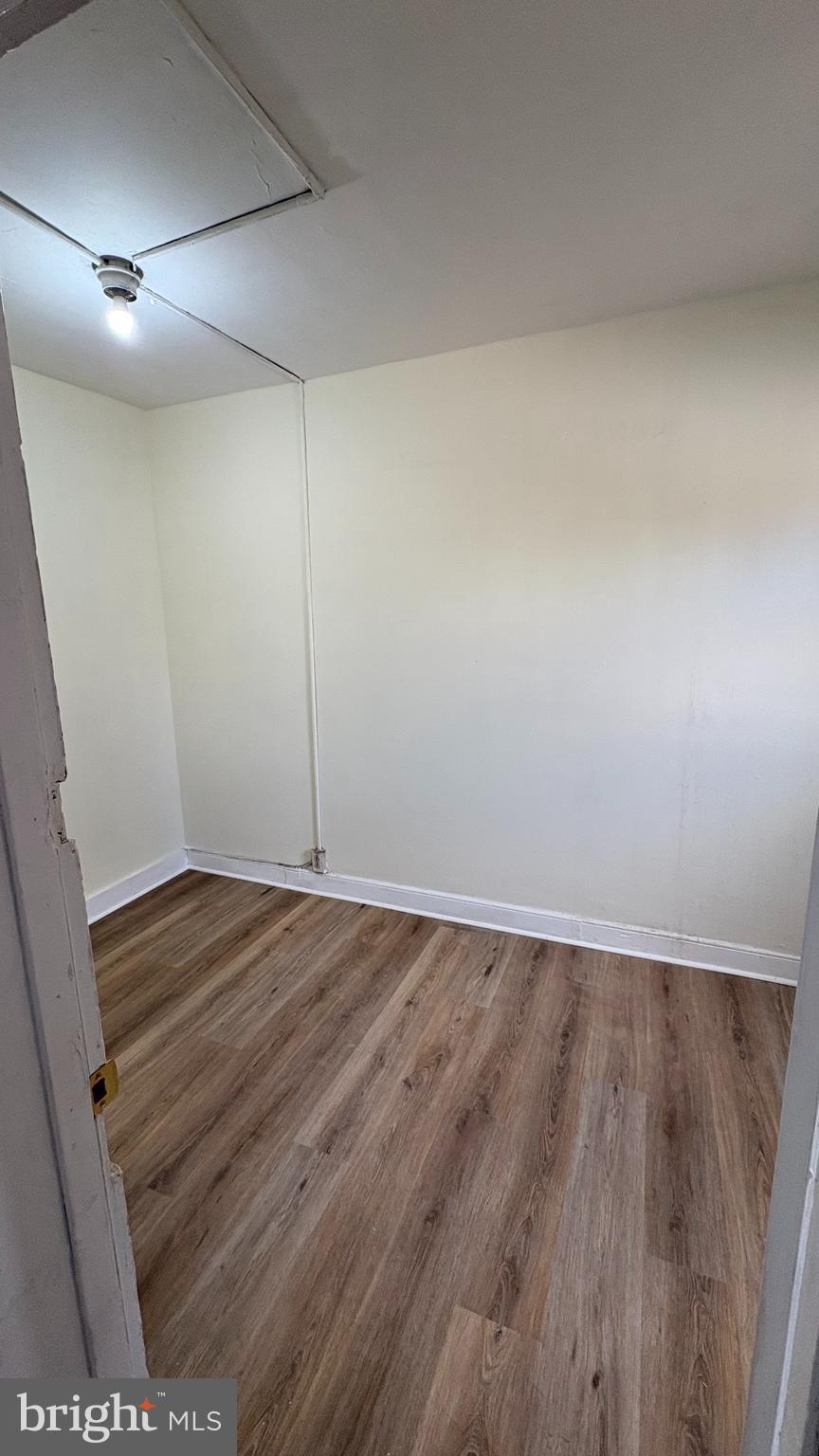 228 North 10th Street, Unit 4F Philadelphia, PA 19107 - Photo 8 of 9 wooden floor in an empty room