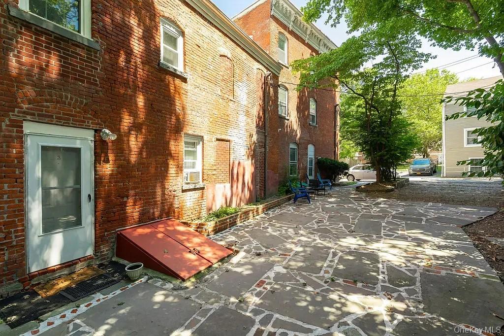 144 Union Street, Unit 4 Poughkeepsie, NY 12601 - Photo 6 of 7 a backyard of a house with outdoor seating