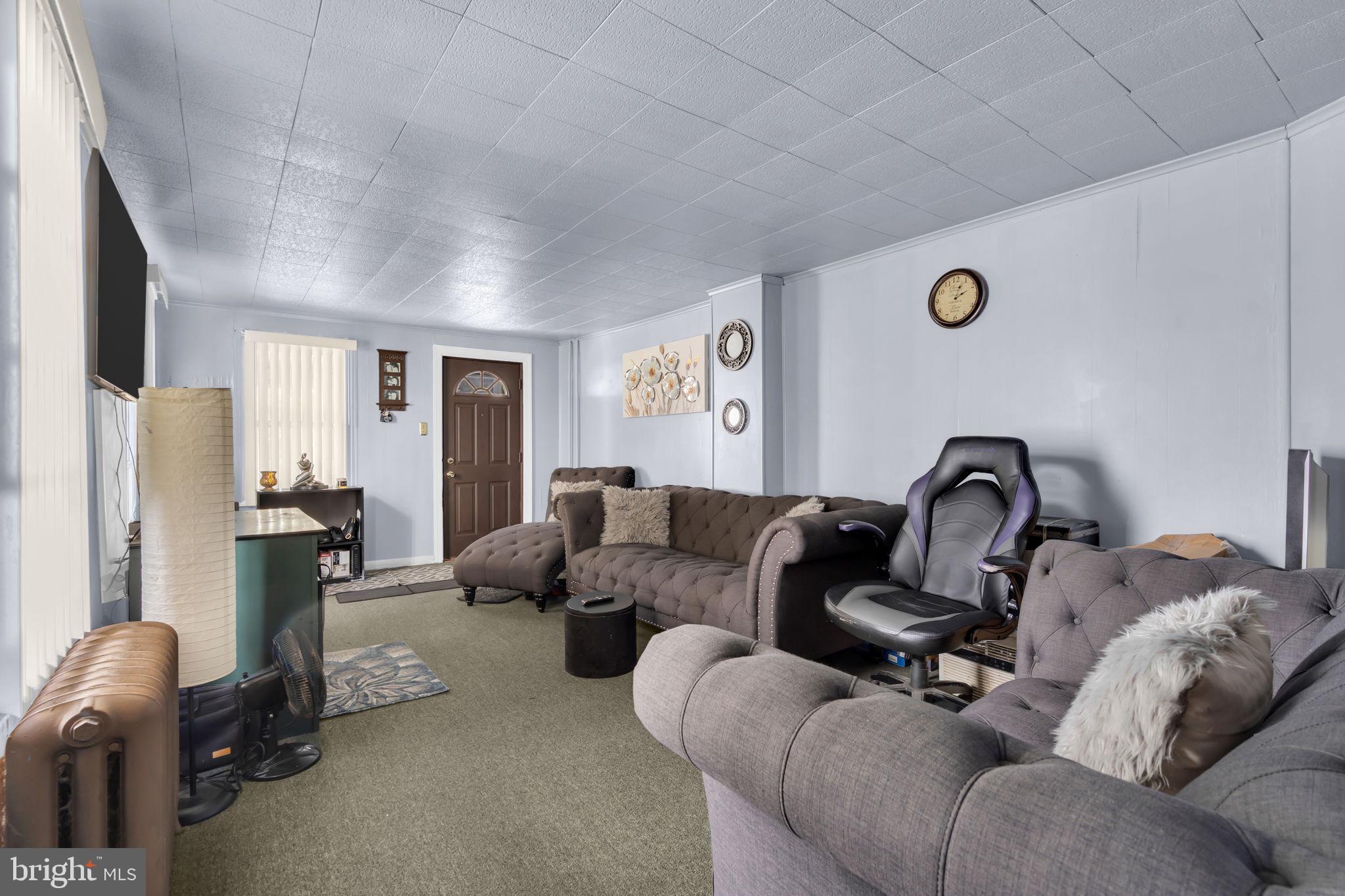 89 Chestnut Street Salem, NJ 08079 - Photo 5 of 20 a living room with furniture and a window