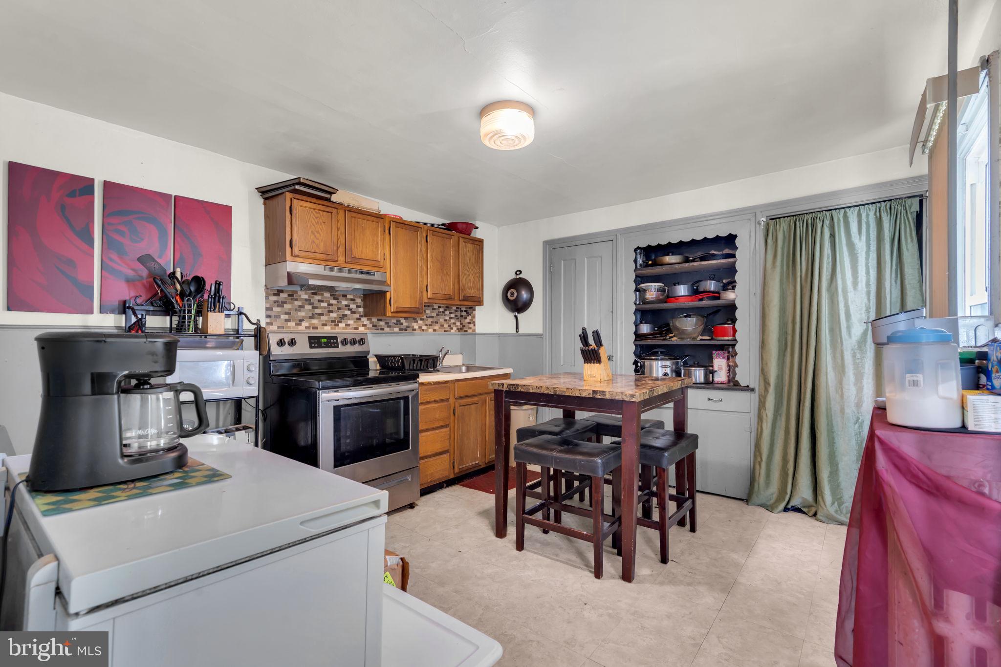 89 Chestnut Street Salem, NJ 08079 - Photo 9 of 20 a kitchen with a table and chairs in it