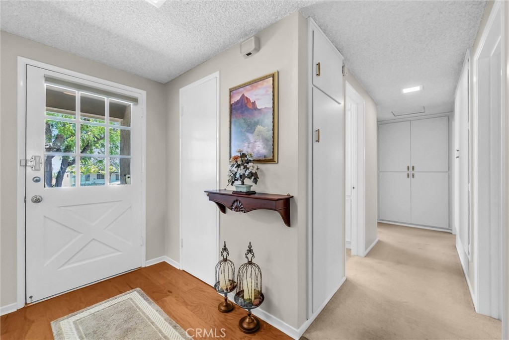 256 East Monterey Road Corona, CA 92879 - Photo 15 of 32 a view of a hallway with workspace
