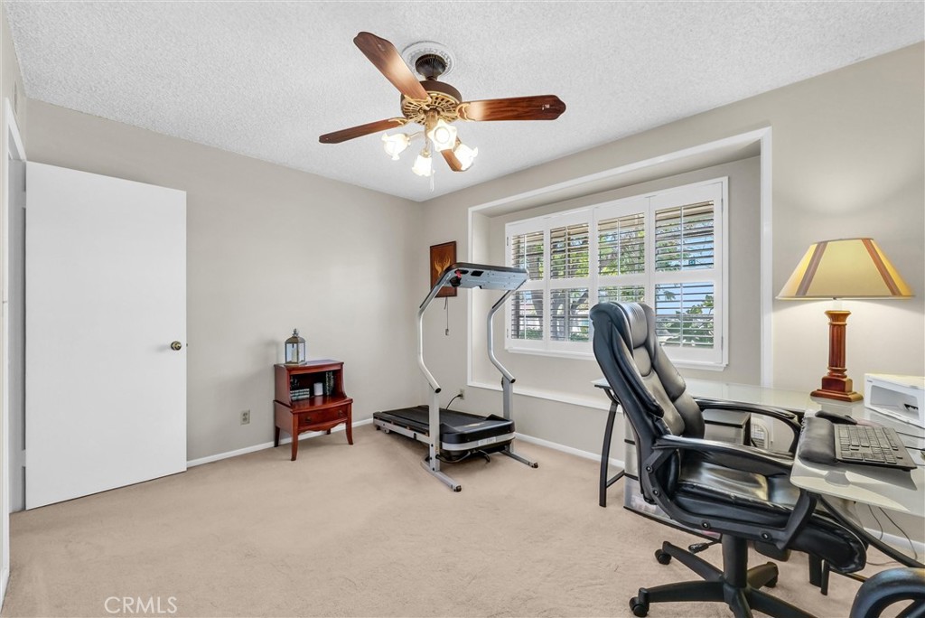 256 East Monterey Road Corona, CA 92879 - Photo 20 of 32 a view of a workspace with furniture and a window
