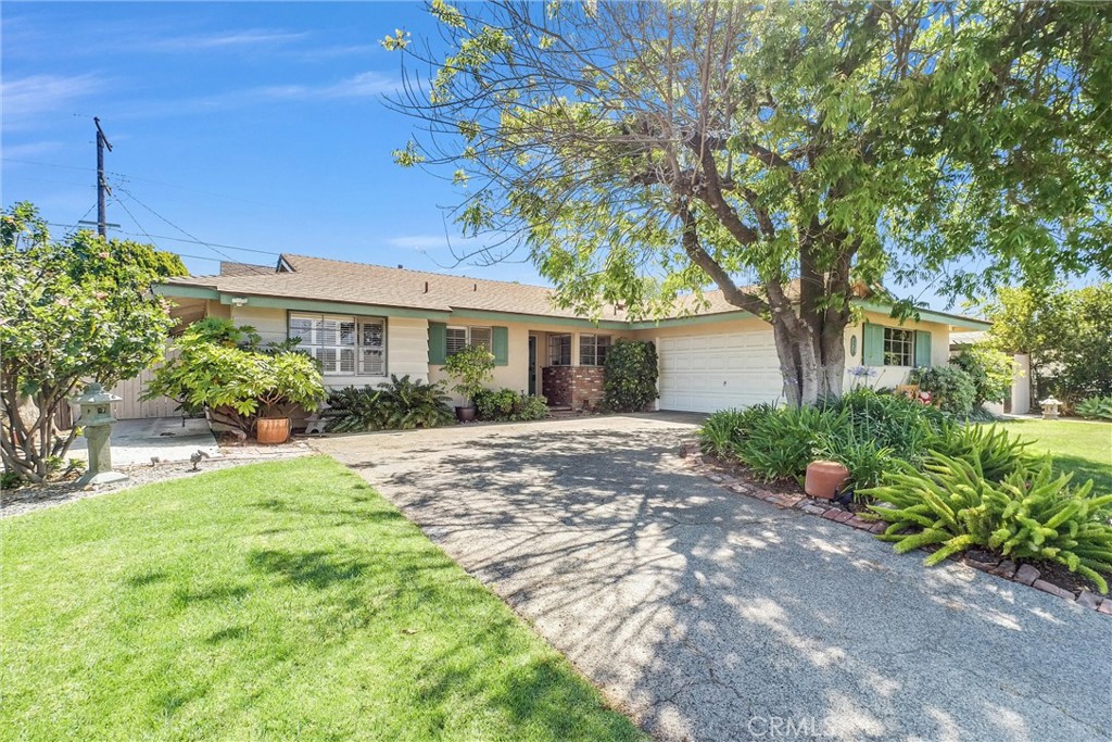 256 East Monterey Road Corona, CA 92879 - Photo 2 of 32 a front view of a house with garden