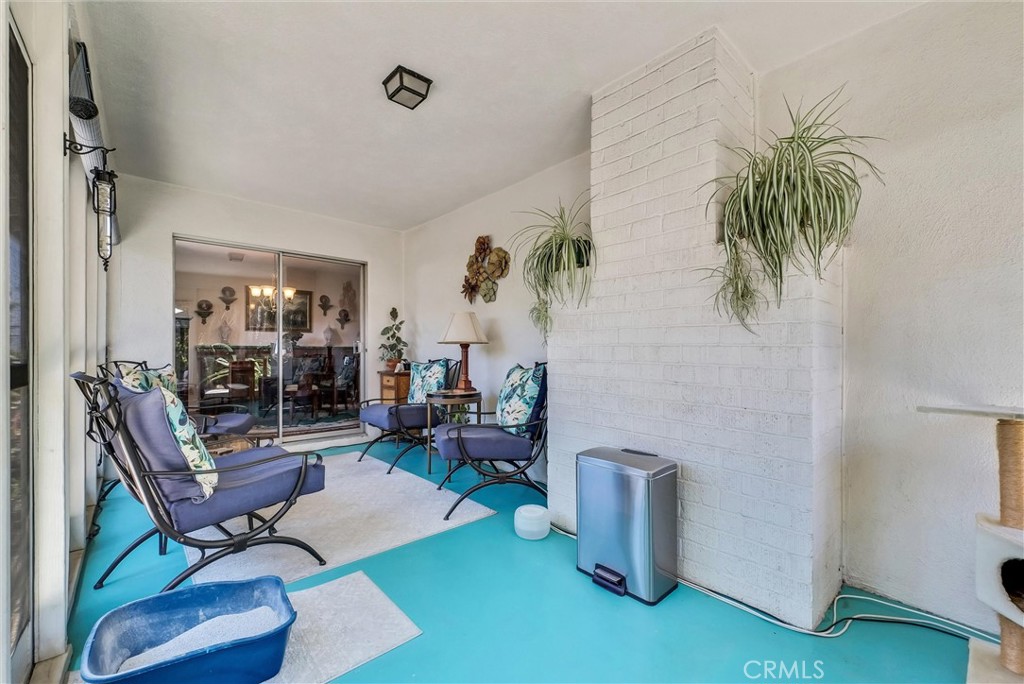 256 East Monterey Road Corona, CA 92879 - Photo 26 of 32 a living room with furniture and a potted plant
