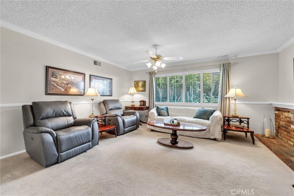 256 East Monterey Road Corona, CA 92879 - Photo 6 of 32 a living room with furniture and a large window