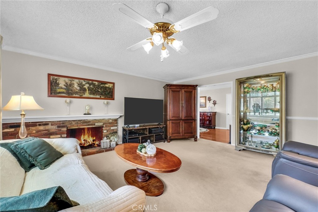 256 East Monterey Road Corona, CA 92879 - Photo 8 of 32 a living room with furniture and a flat screen tv