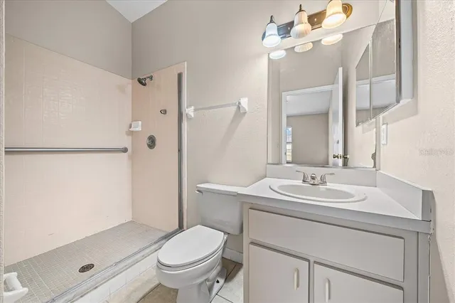 a view of a hallway with closet and bathroom