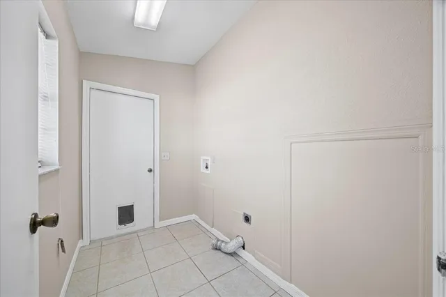 an aerial view of a residential houses with yard