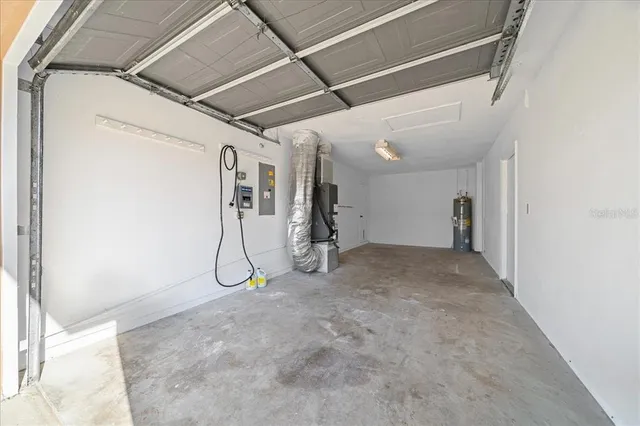an aerial view of a house with a lake view