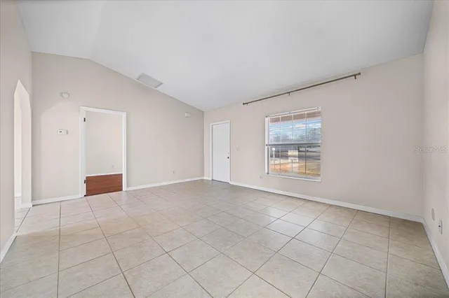 a kitchen with cabinets appliances a sink and a counter top