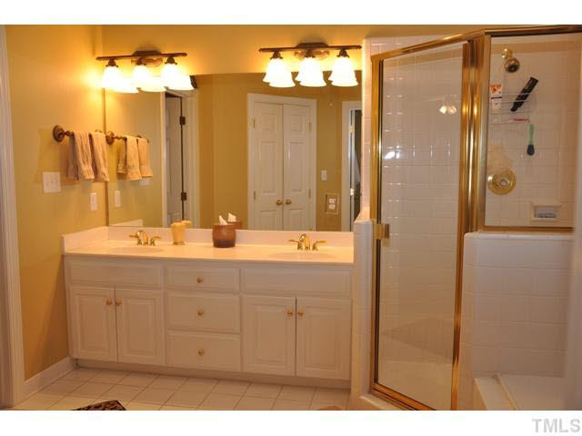 8904 Windjammer Drive Raleigh, NC 27615 - Photo 16 of 25 Double sink, lots of storage in vanity; very roomy Master Bath/Spa