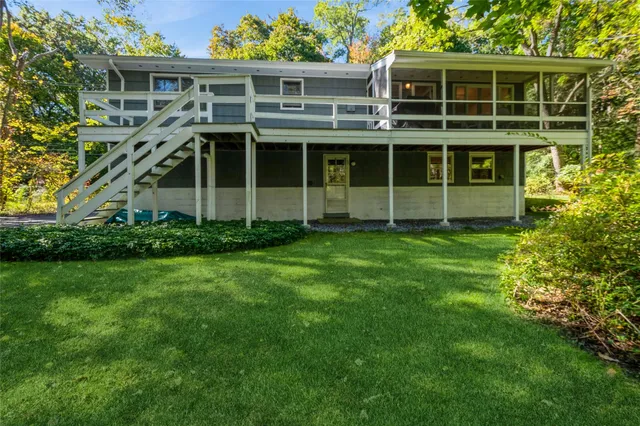 a large tree in front of a house