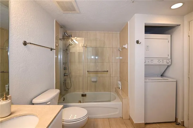 a bathroom with a toilet sink and shower