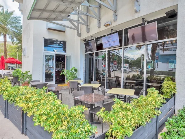 a view of a chairs and table in a patio