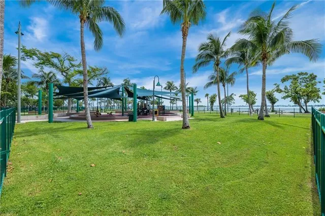 a view of yard with swimming pool and green space