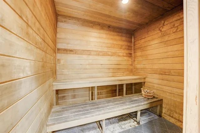 a view of a balcony with wooden floor and lounge chair
