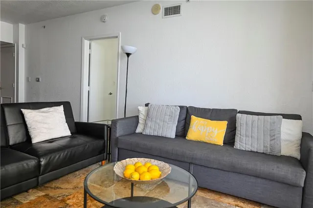 a living room with furniture and a couch