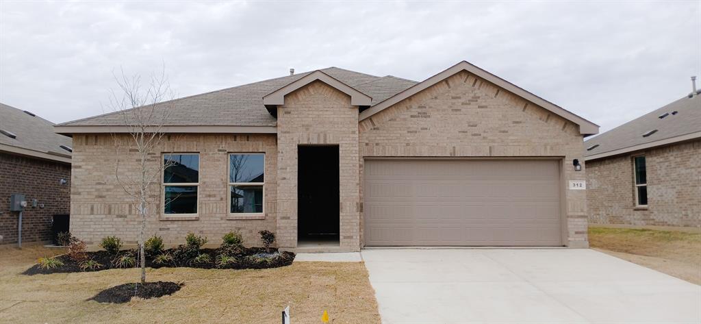 312 Perk Street Keene, TX 76059 - Photo 10 of 13 a front view of a house with garage