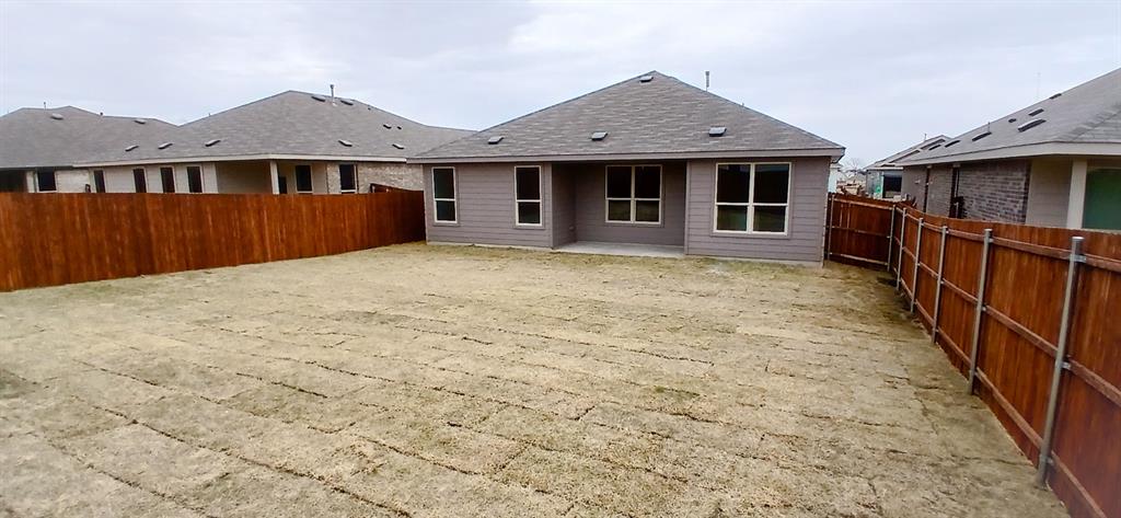 312 Perk Street Keene, TX 76059 - Photo 12 of 13 a front view of a house with yard