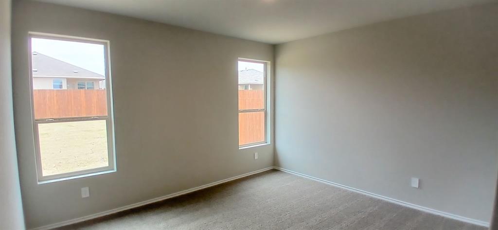312 Perk Street Keene, TX 76059 - Photo 3 of 13 a view of an empty room and window