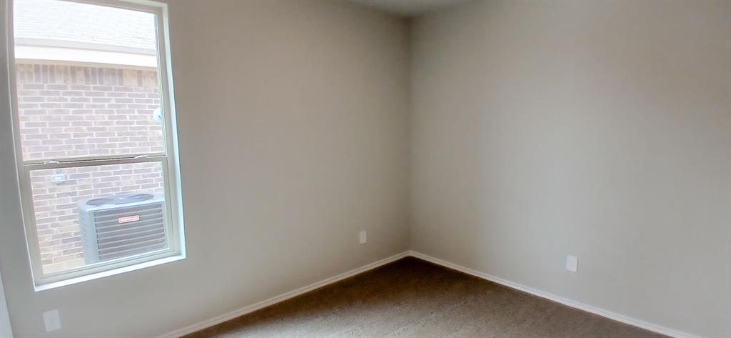 312 Perk Street Keene, TX 76059 - Photo 8 of 13 a small space with a window