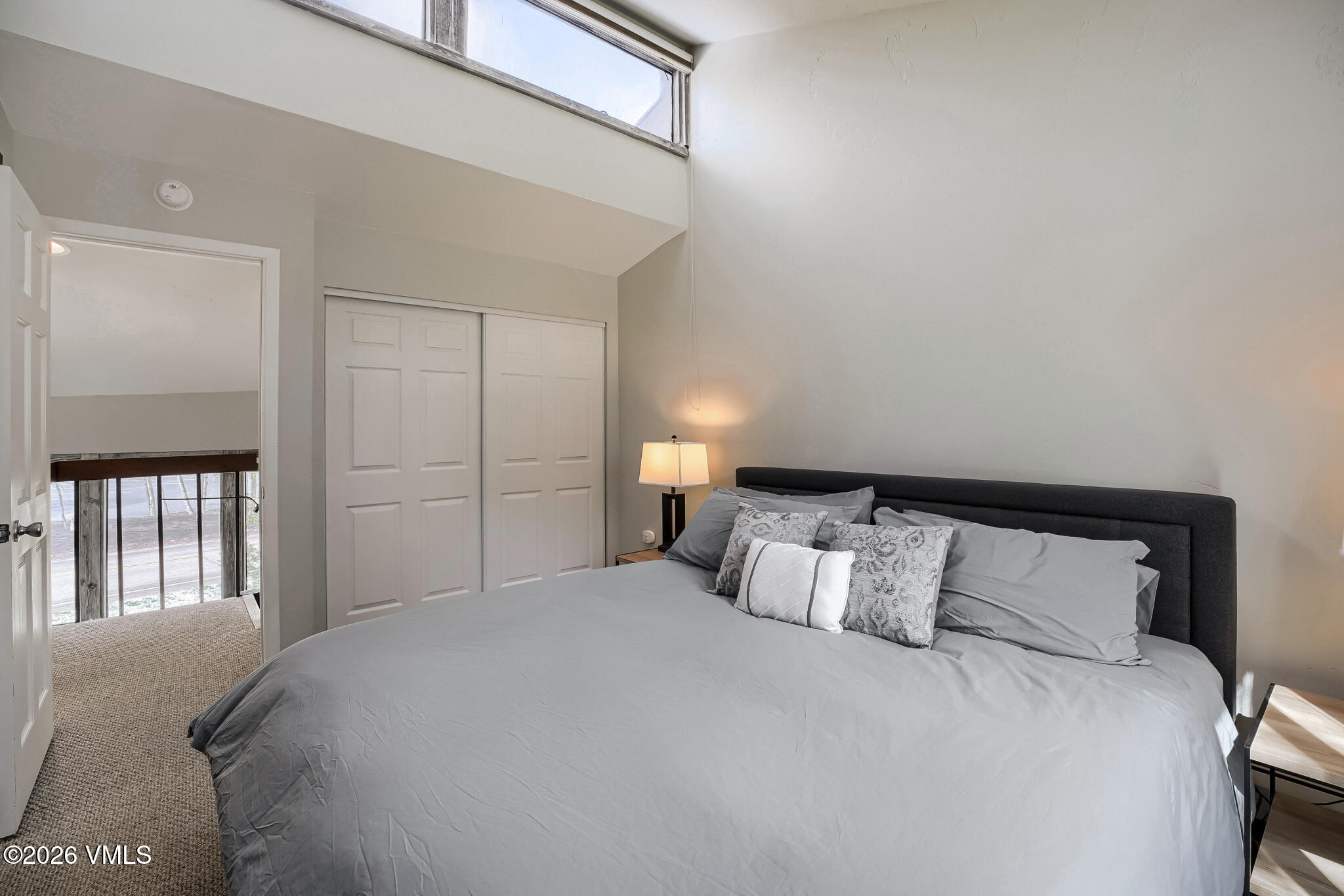 142 Eagle Drive, Unit C1 Avon, CO 81620 - Photo 13 of 20 a bedroom with a bed and window