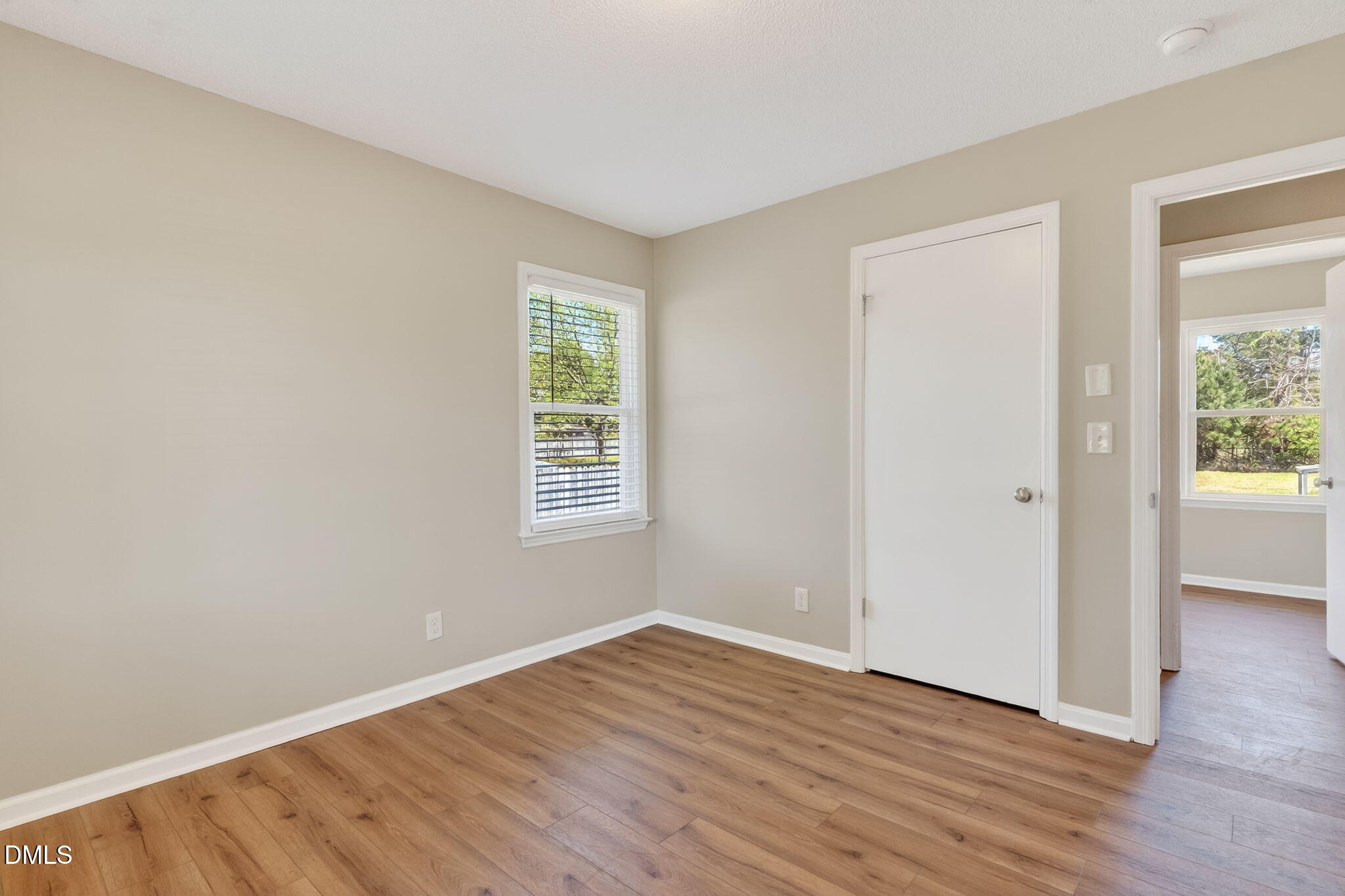 6086 Red Hill Church Road Coats, NC 27521 - Photo 20 of 44 an empty room with wooden floor and windows