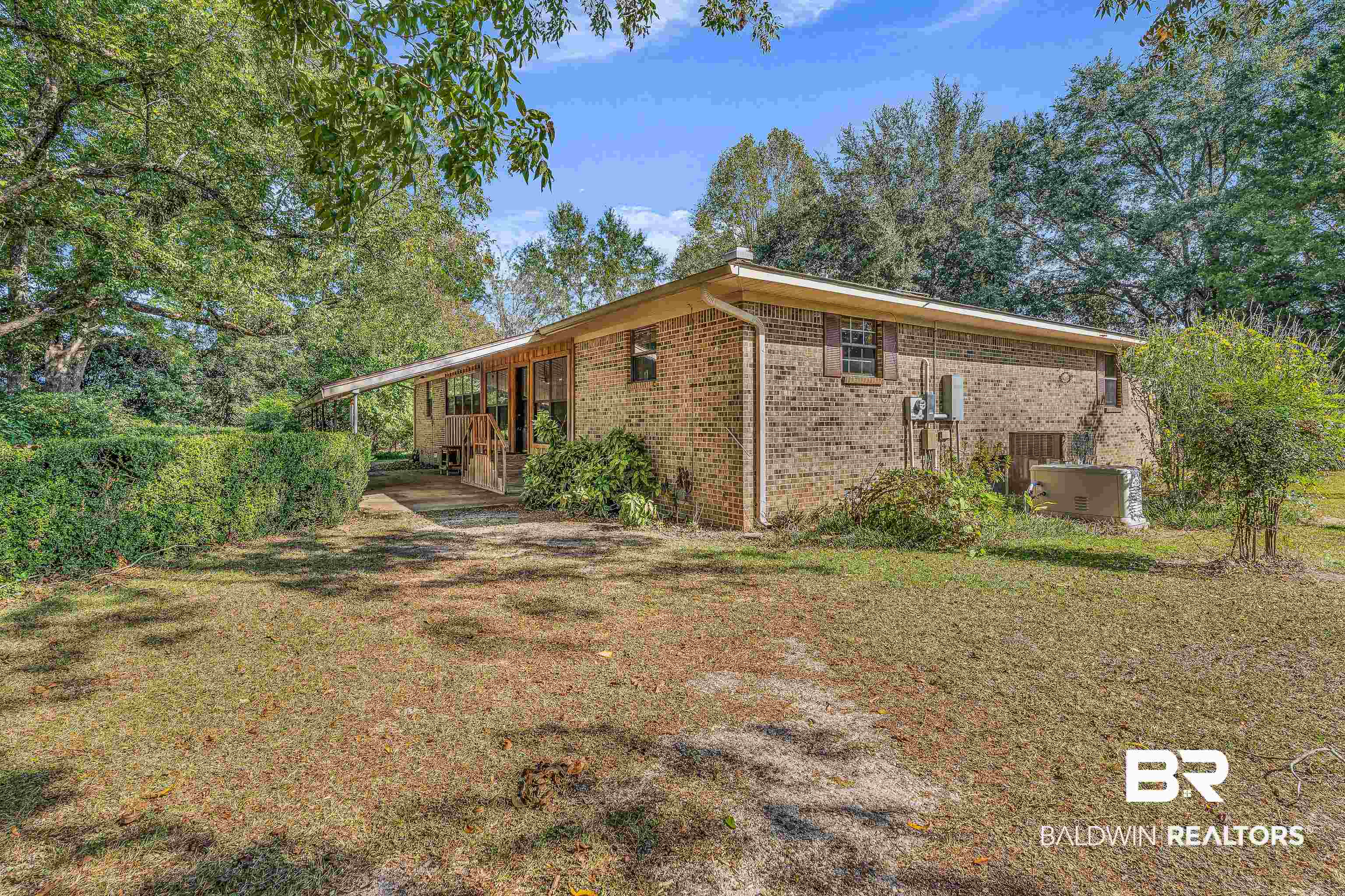 72075 Highway 59 Little River, AL 36550 - Photo 4 of 40 View of side of home featuring brick siding, a lawn, and covered porch